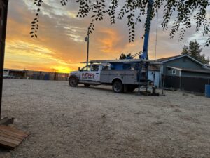 Phipps Water Solutions well service truck at an Idaho residential property