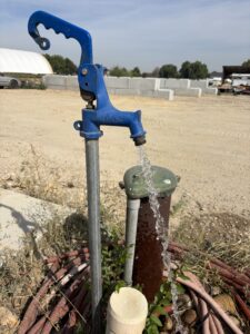 Water flowing from a private well hand pump in Idaho