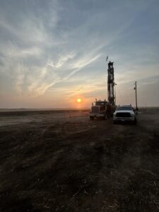 Water well drilling rig operating at a rural Idaho property